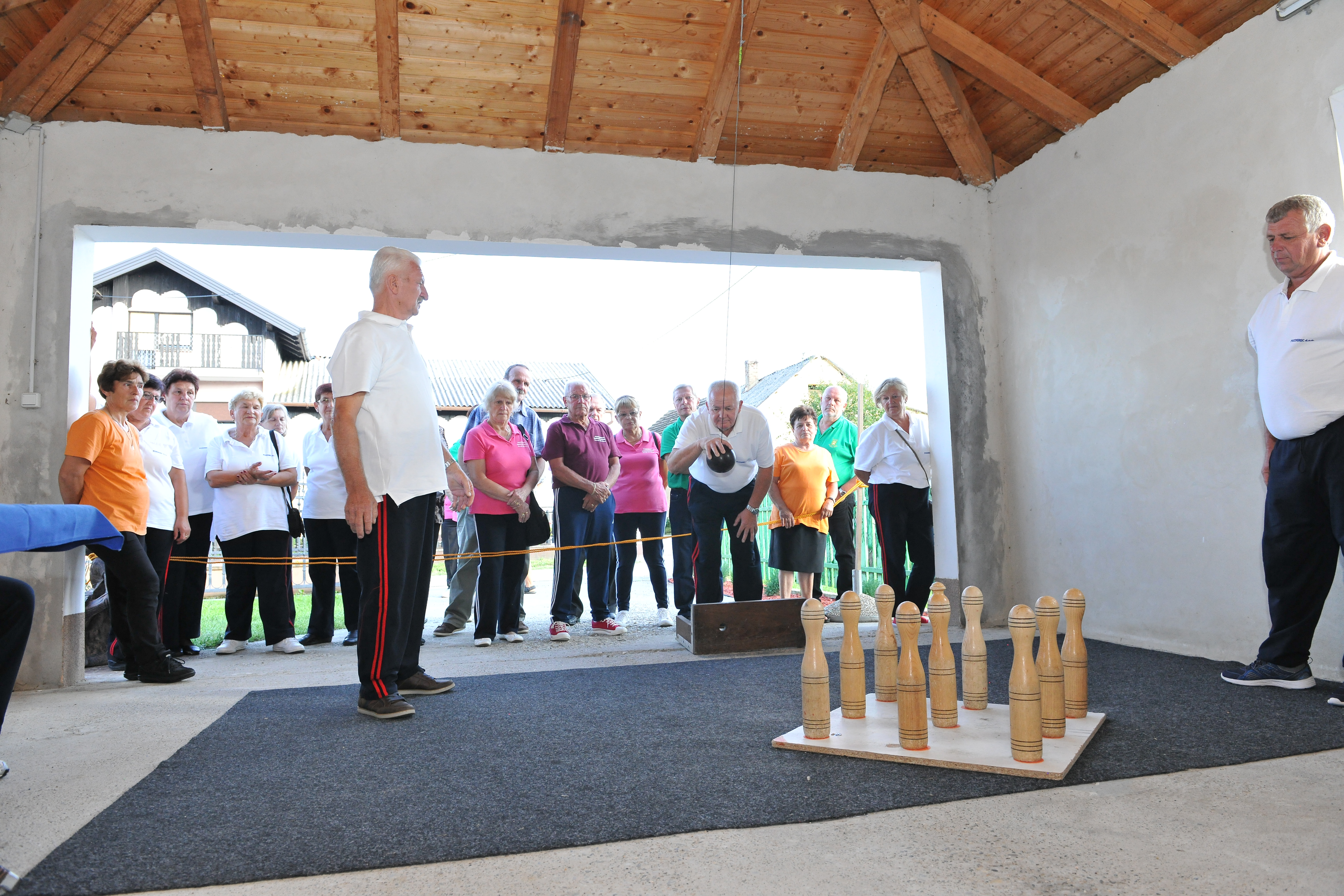 Senior's playing bowling.